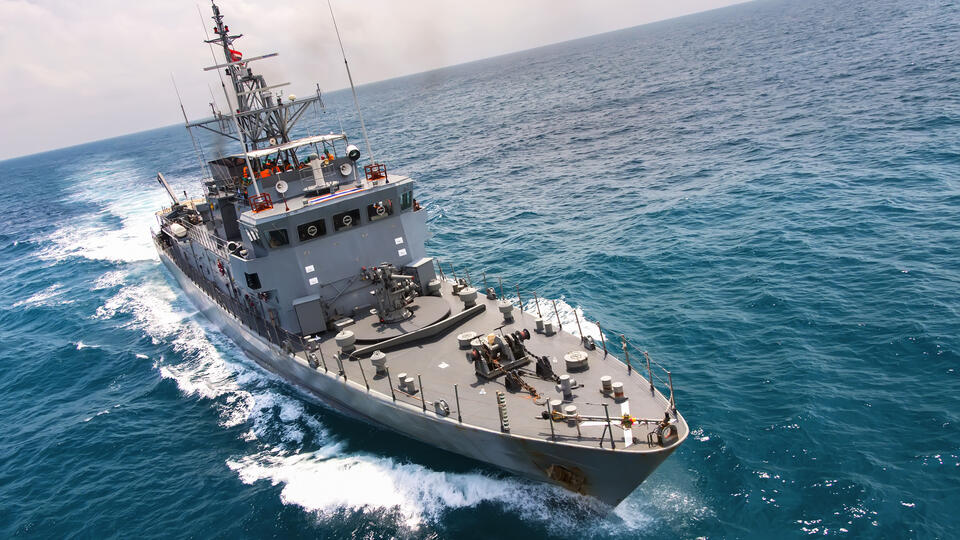 Navy vessel in the open ocean.